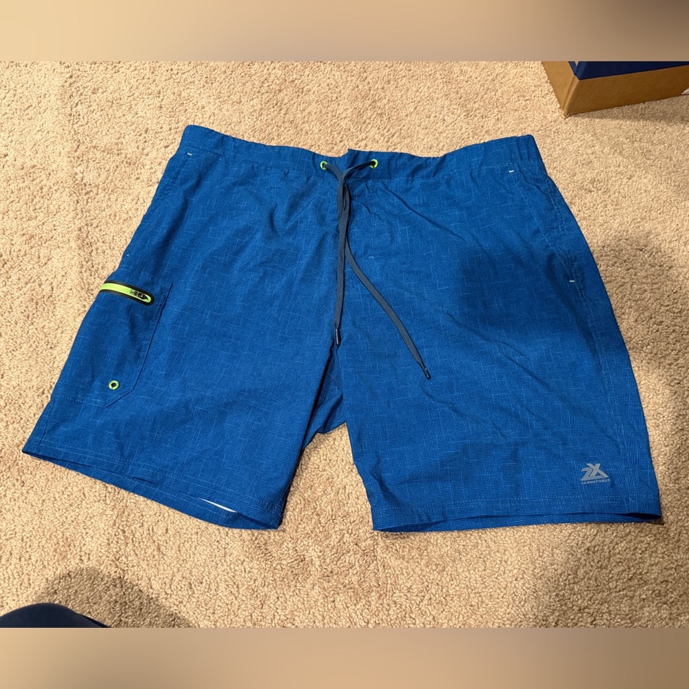 ZeroXposur vibrant blue men’s swimsuit with Lime Lining
